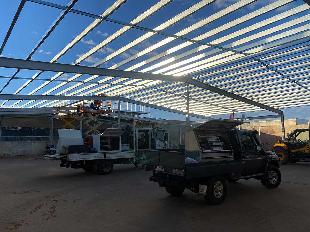 A Truck Is Parked In Front Of A Building Under Construction— Custom Steel Fab in Tennant Creek, NT