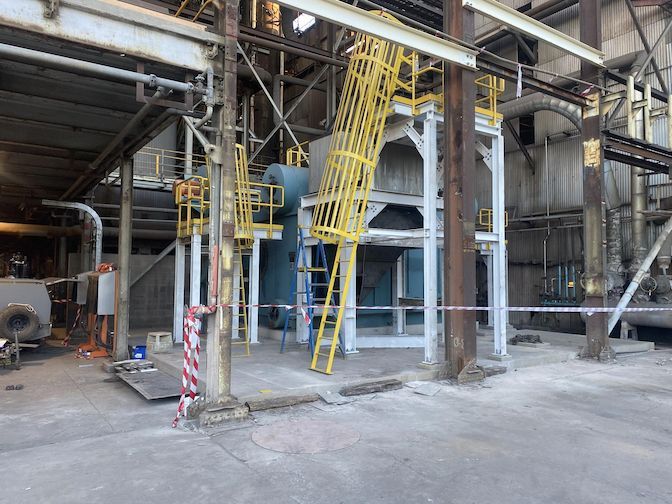 A Factory With A Yellow Ladder In The Middle Of It — Custom Steel Fab in Garbutt, QLD