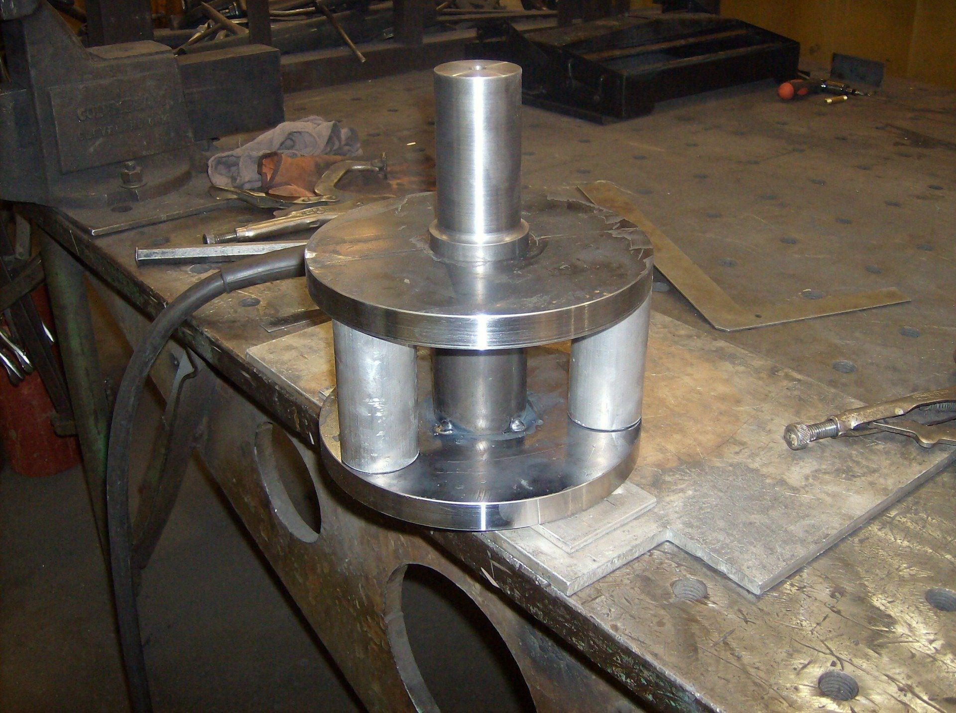 Man Customizing The Metal — Olivia, NC — Olivia Machine & Tool, Inc