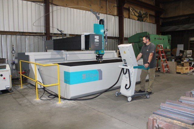 Man Running Test To The Machine — Olivia, NC — Olivia Machine & Tool, Inc