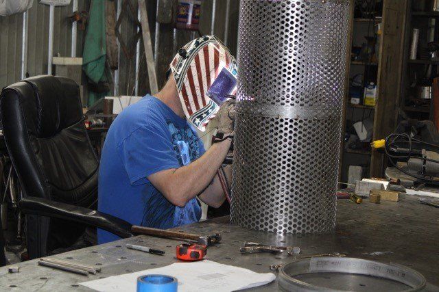 Man Customizing The Metal — Olivia, NC — Olivia Machine & Tool, Inc