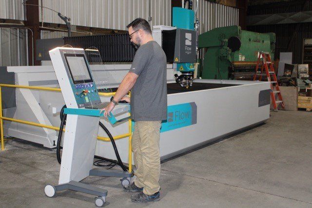 Man Configuring The Machine — Olivia, NC — Olivia Machine & Tool, Inc