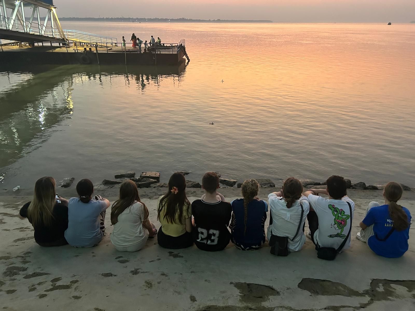 Student Group watching the sunset on the banks of the Hooghly River, a tributary of the sacred Ganges. 