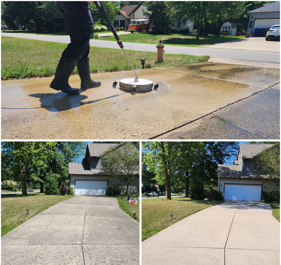 A person is cleaning a driveway with a machine.