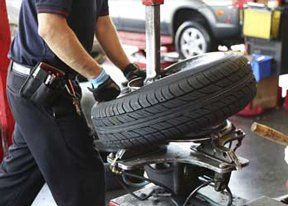 Mechanic changing car tire
