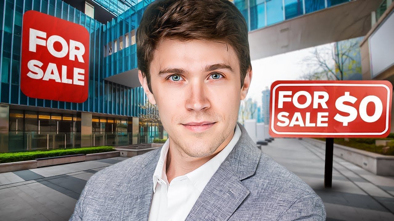 Man in a blazer smiles, with signs for 