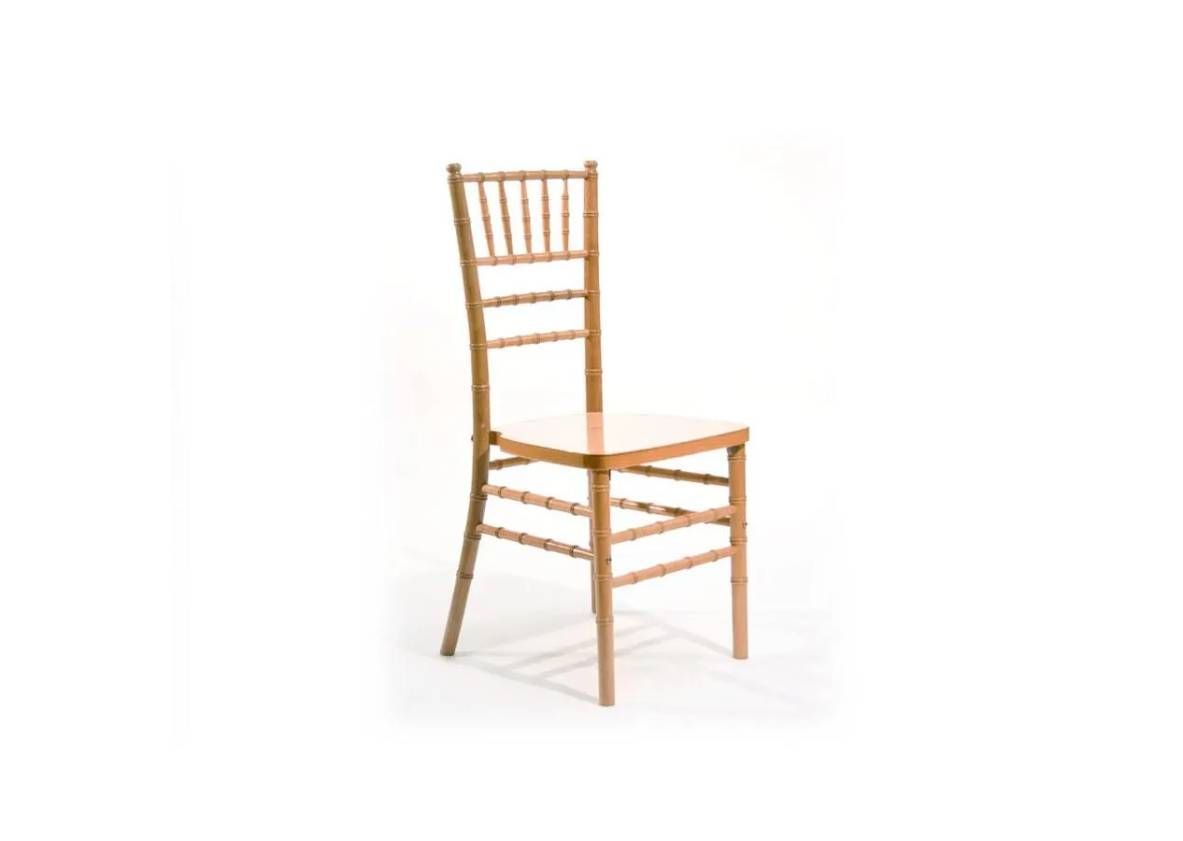 A light wood chiavari chair with a spindled backrest, set against a plain white background.