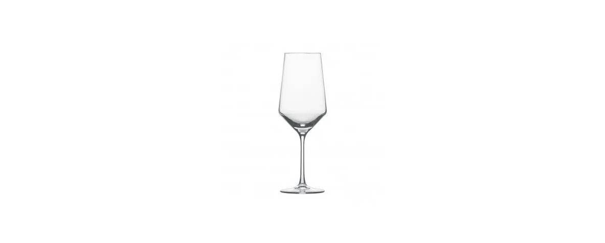 A clear, stemmed champagne flute against a white background.