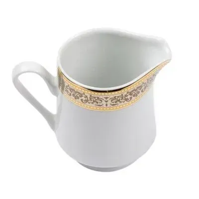 A white ceramic creamer with a gold and gray ornate band pattern around the top, isolated on a white background.
