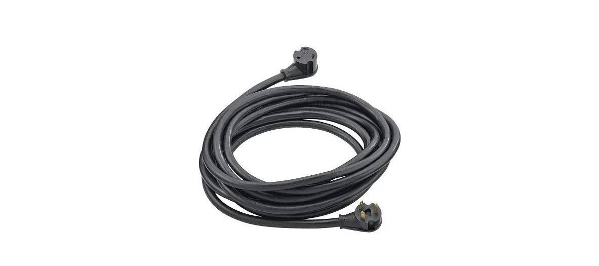 A black power extension cord coiled into a circle with a plug on each end.