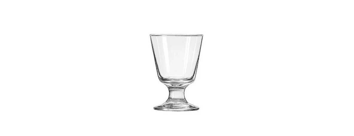 Clear glass on a short pedestal stem against a white background.
