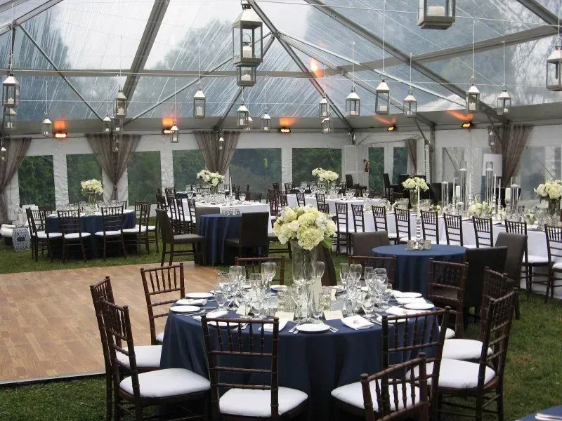 A clear-topped tent setup for an event.