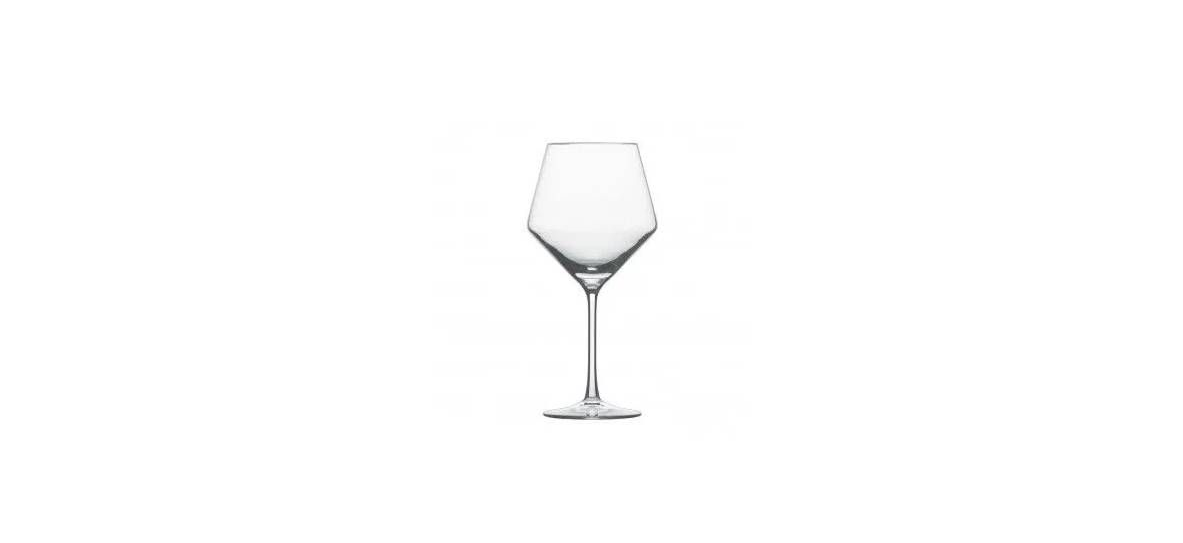 A clear, crystal stemmed wine glass with a wide, angular bowl against a white background.