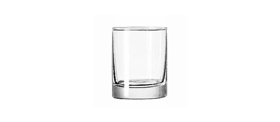 A clear, cylindrical glass tumbler with a thick base, centered against a white background.
