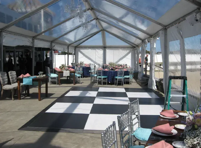 A rectangular, silver-colored metal baking sheet with a perforated surface for even heat distribution.