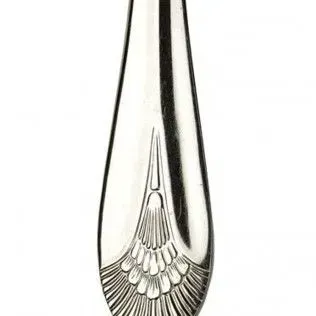 Close-up of a metallic silver spoon handle featuring an intricate, fan-shaped decorative engraving at the base.