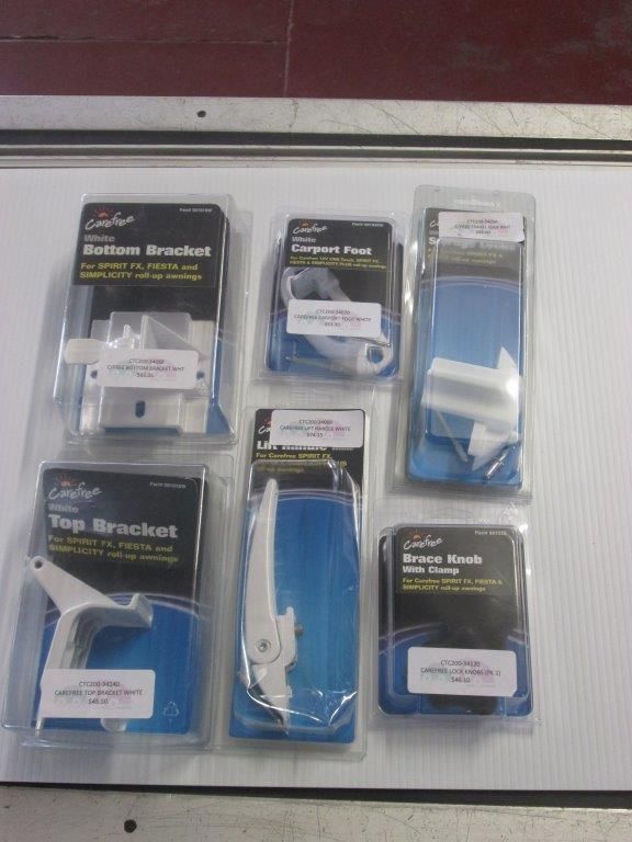 Various White Window Hardware In Packaging On A Silver Surface — Caravan Experts In The Charters Towers Region, QLD