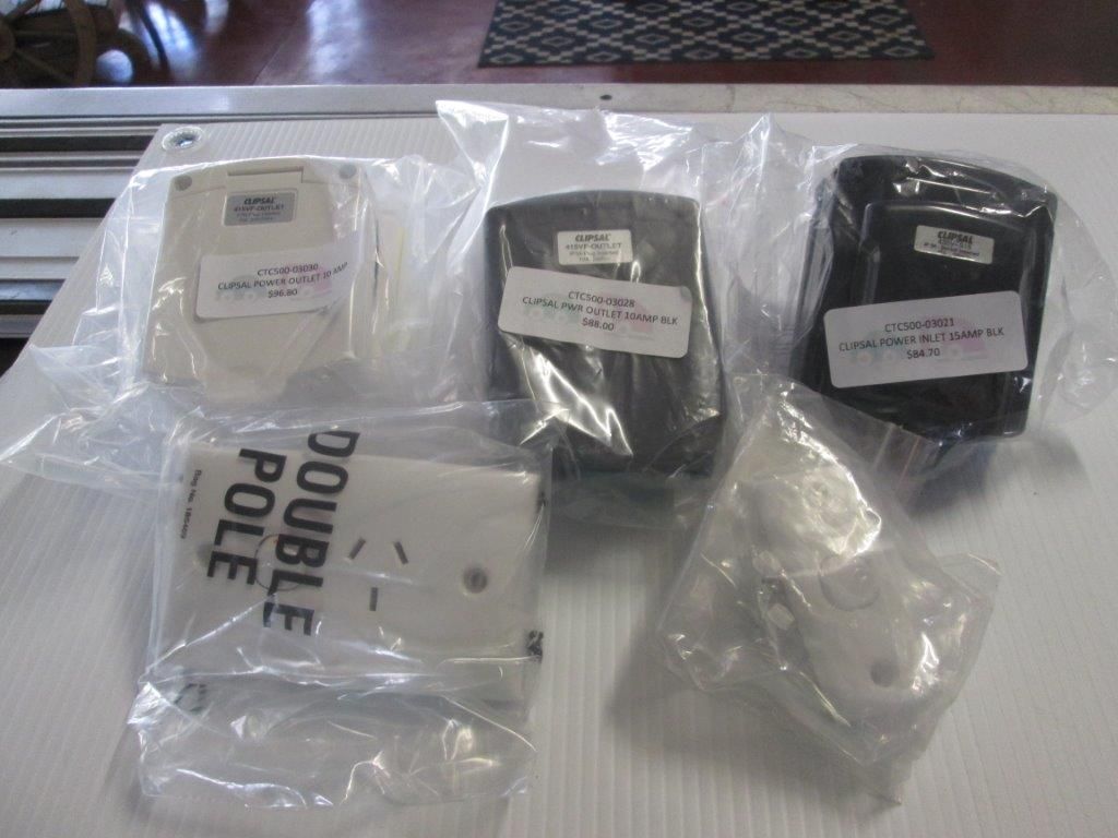 Five Electrical Outlets In Plastic Bags, Varying In Color — Caravan Experts In The Charters Towers Region, QLD