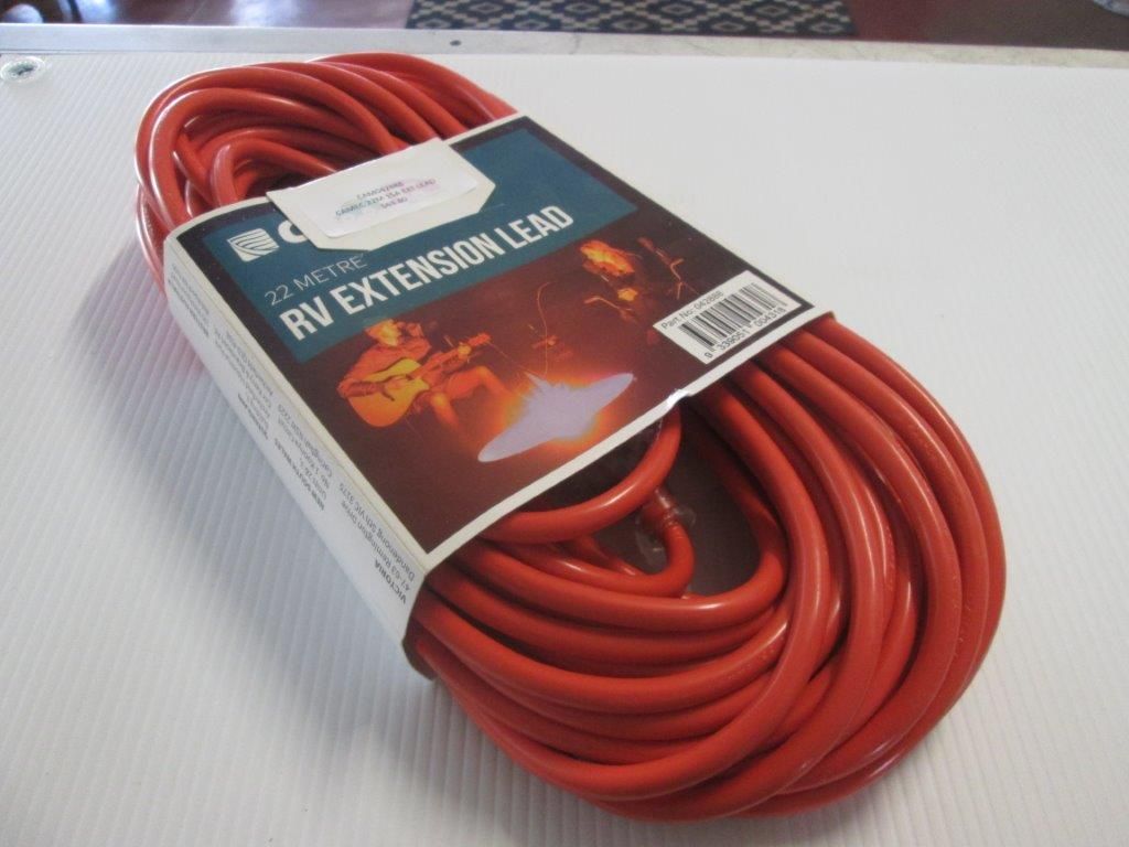 Coiled Red Rv Extension Lead With Packaging On A White Surface — Caravan Experts In The Charters Towers Region, QLD