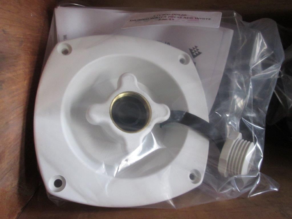 White Rv Water Inlet With Attached Hose And Mounting Holes — Caravan Experts In The Charters Towers Region, QLD