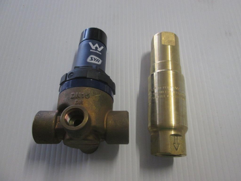 Two Brass Pressure Regulators, One With A Black Top — Caravan Experts In The Charters Towers Region, QLD