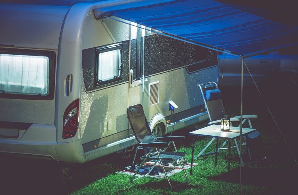 Caravan with Open Blue Awning — Caravan Experts In The Charters Towers Region, QLD