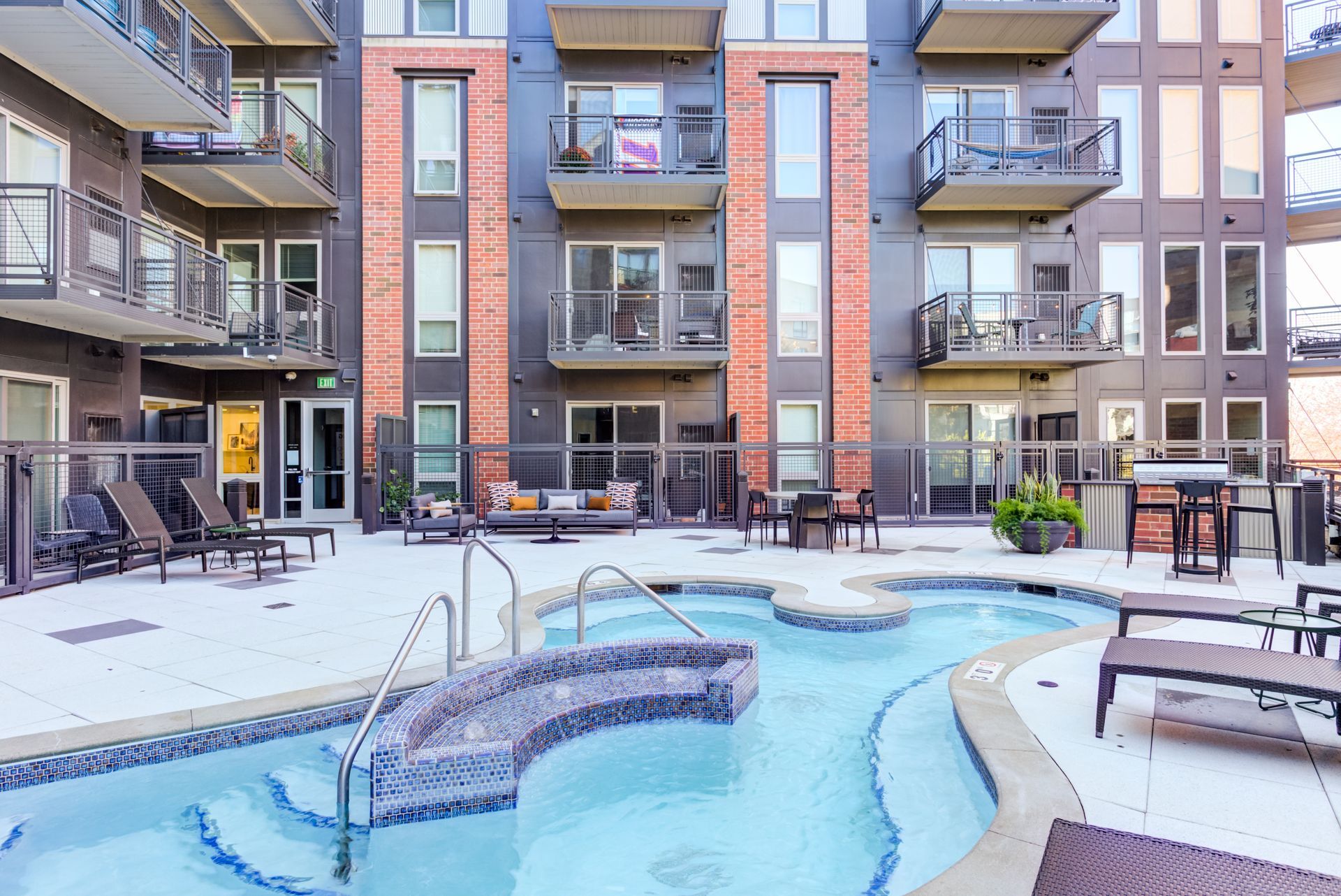 there is a large swimming pool in the middle of a building .