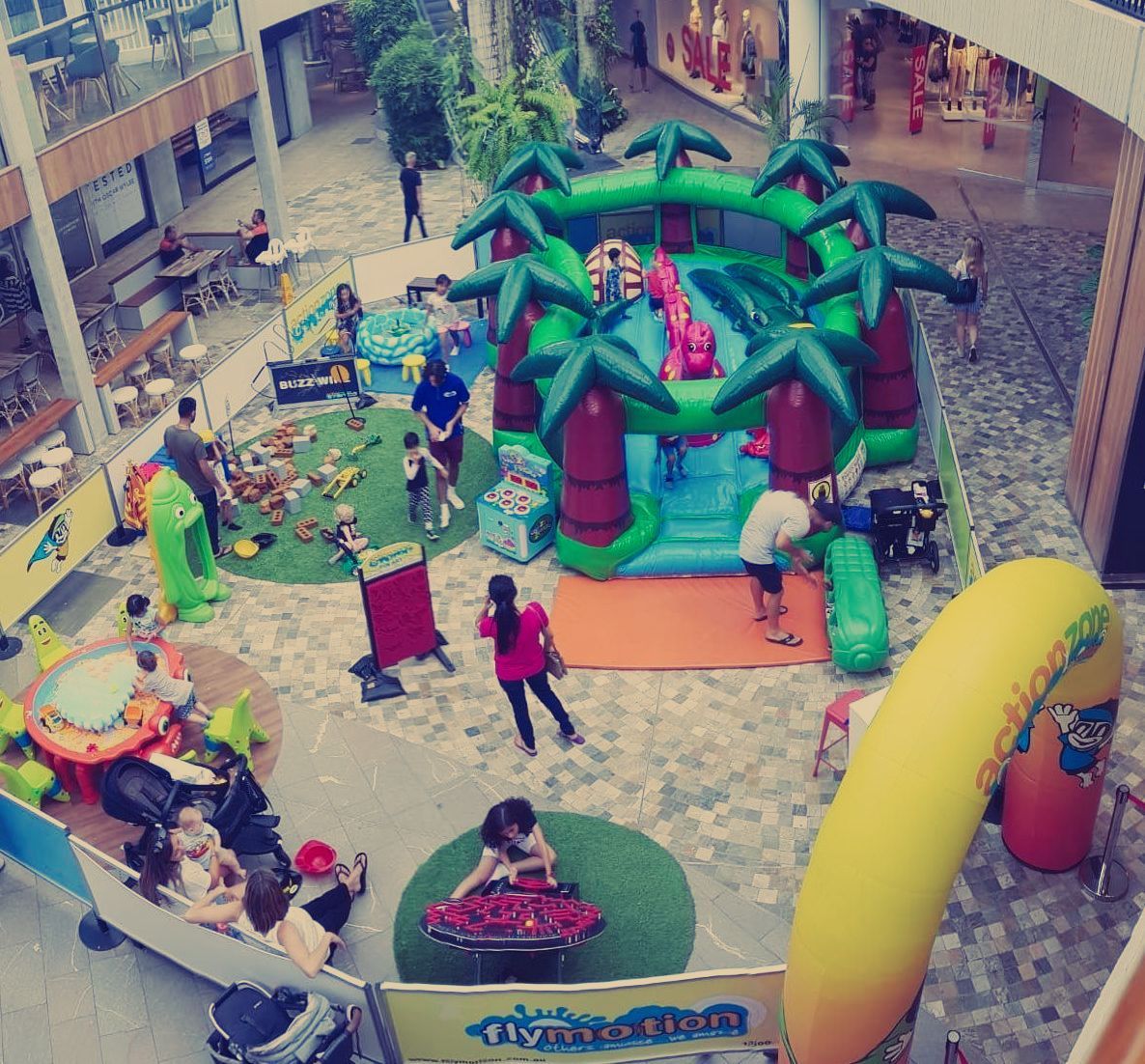 Young kid trying to climb the inflatable castle