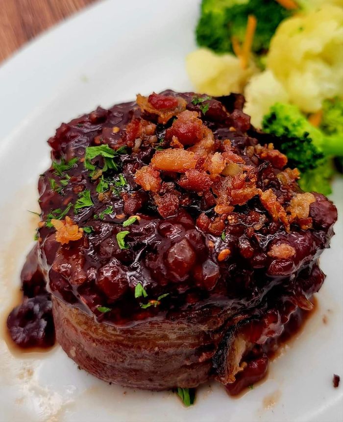 A close up of a plate of food with broccoli and mashed potatoes