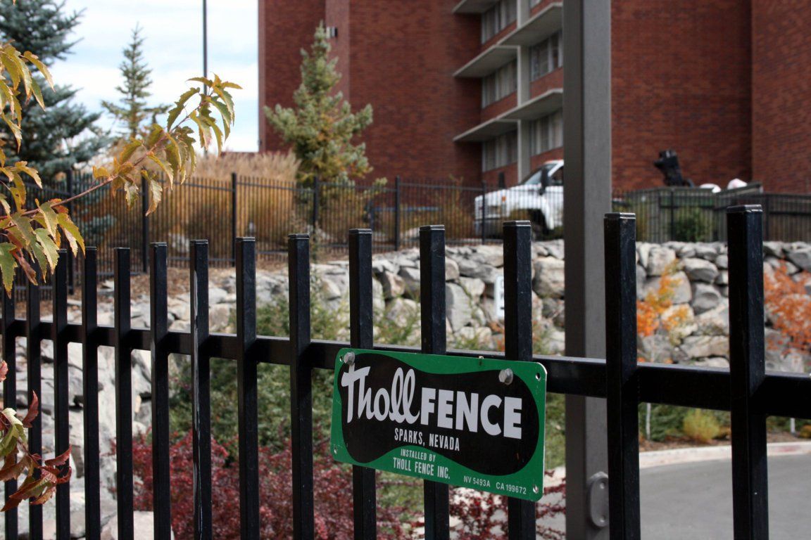 Fence With Tholl Fence Logo — Sparks, NV — Tholl Fence, Inc.
