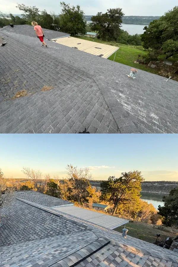 A woman is standing on top of a roof with a view of a lake.