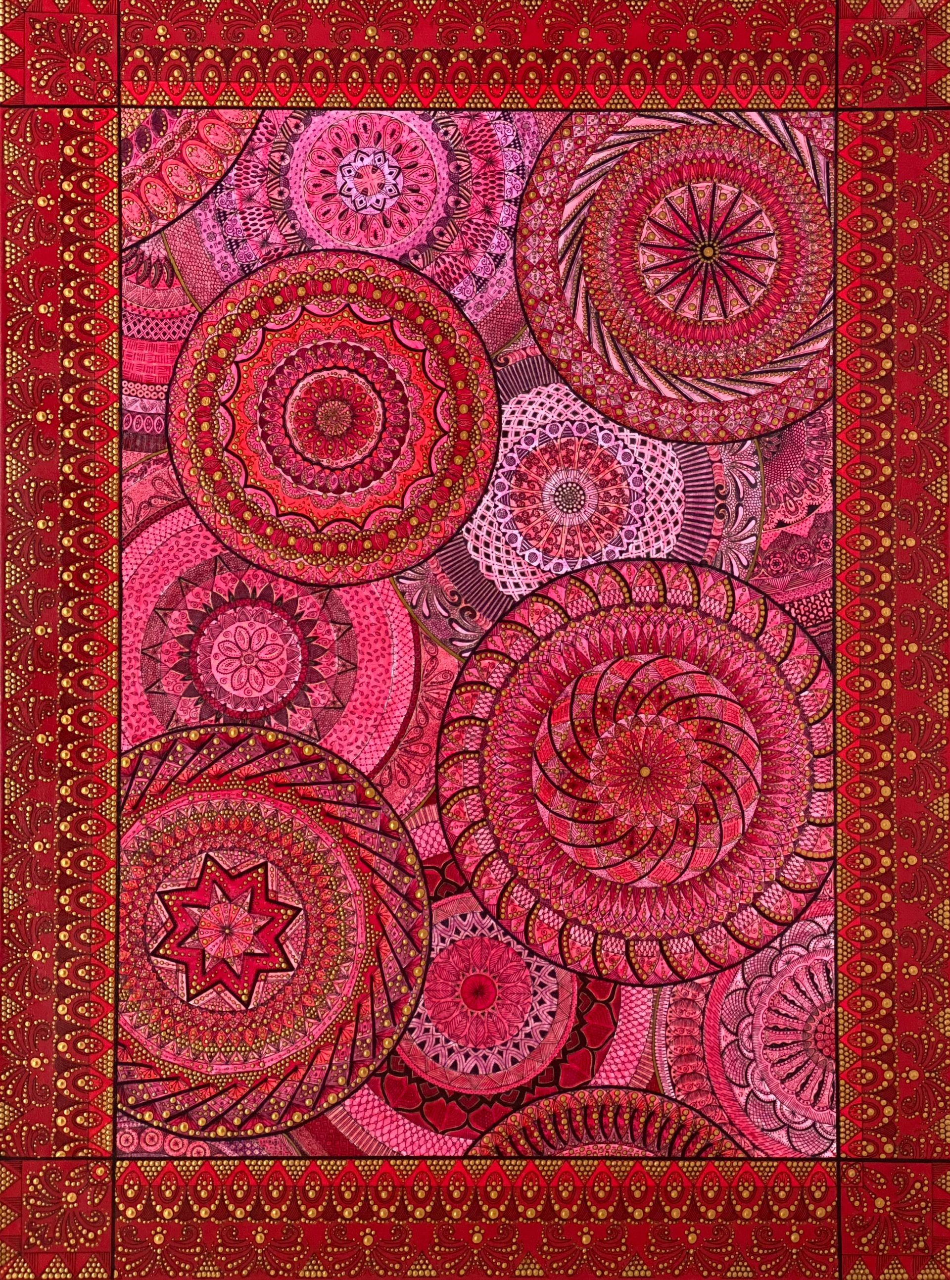 Rood en roze mandala-patroon vloerkleed met een goudkleurige rand.