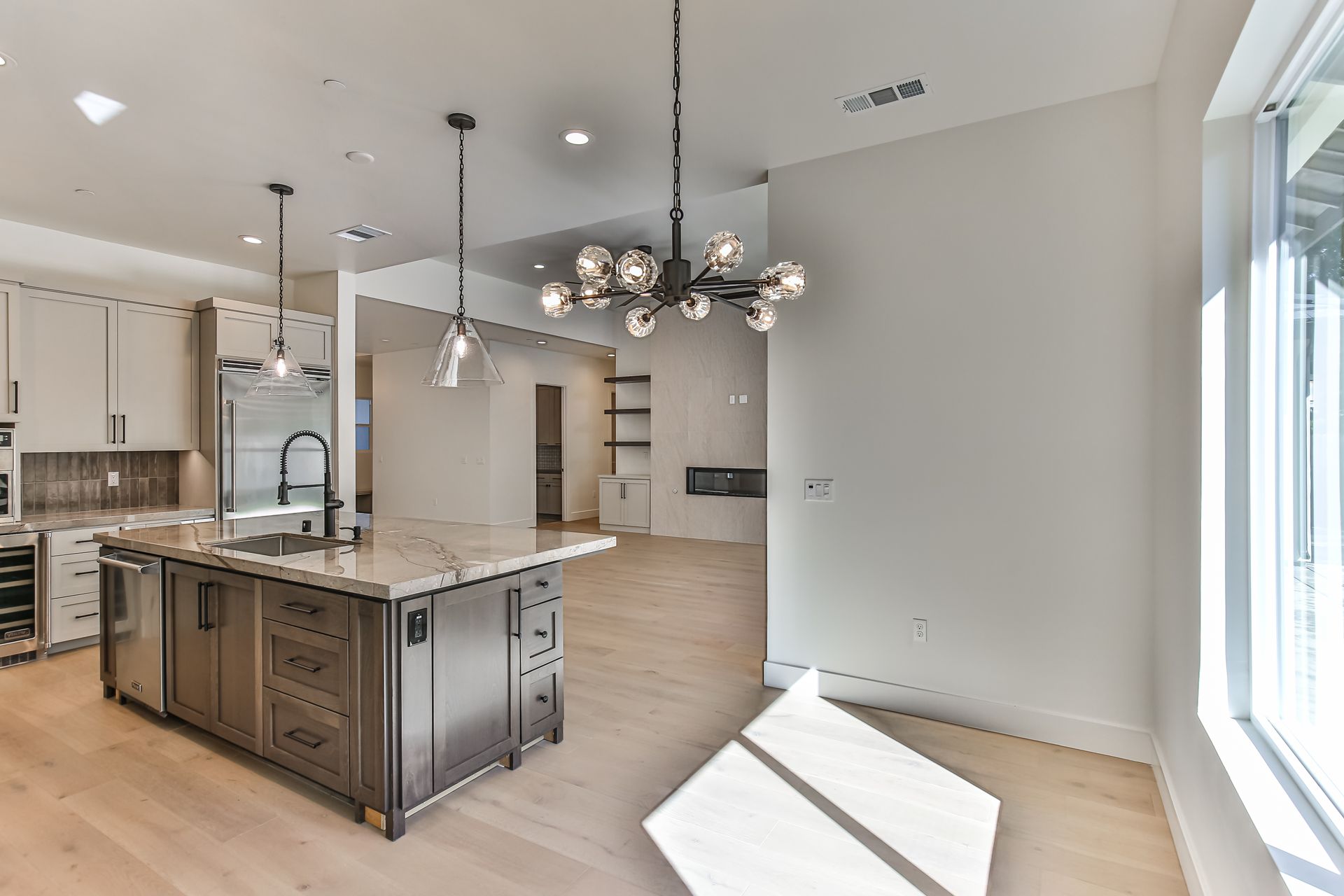 There is a large island in the middle of the kitchen.