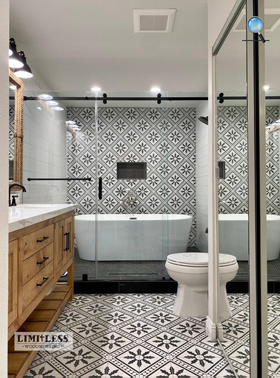 A bathroom with a bathtub , toilet , sink and shower.