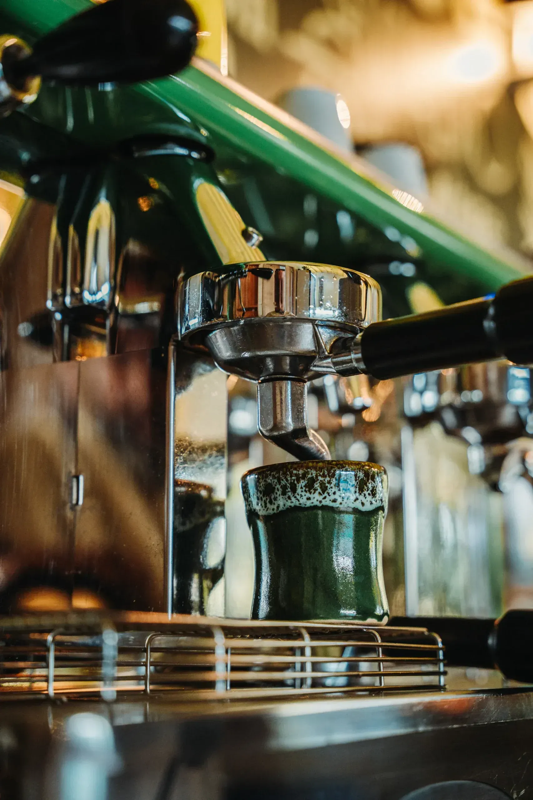 A close up of a coffee machine making a cup of coffee.