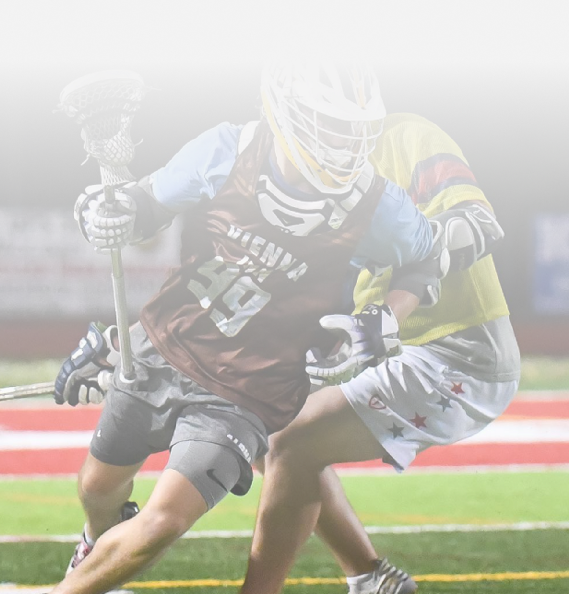 A lacrosse player with the number 19 on his jersey