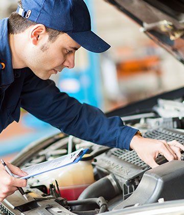 Auto Mechanic Checking Car Condition - Automotive Repair in Hillsborough, NC
