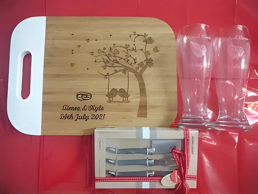 A Wooden Cutting Board with Glasses and Knives — Ace Wholesale Trophies & Engraving In Airlie Beach, QLD