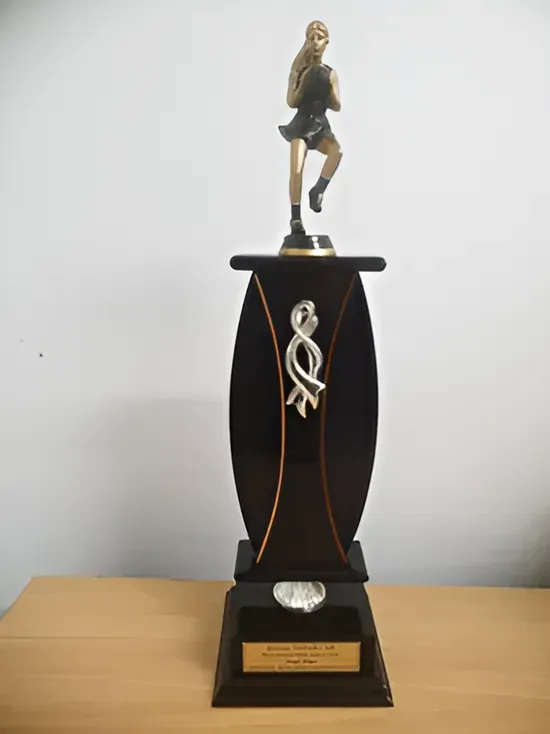 A Trophy with a Statue of a Woman on Top of It — Ace Wholesale Trophies & Engraving In Proserpine, QLD