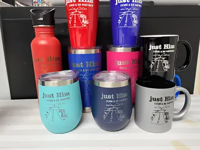A Bunch of Tumblers and Mugs with the Word 'Just Him' on Them — Ace Wholesale Trophies & Engraving In Bowen, QLD