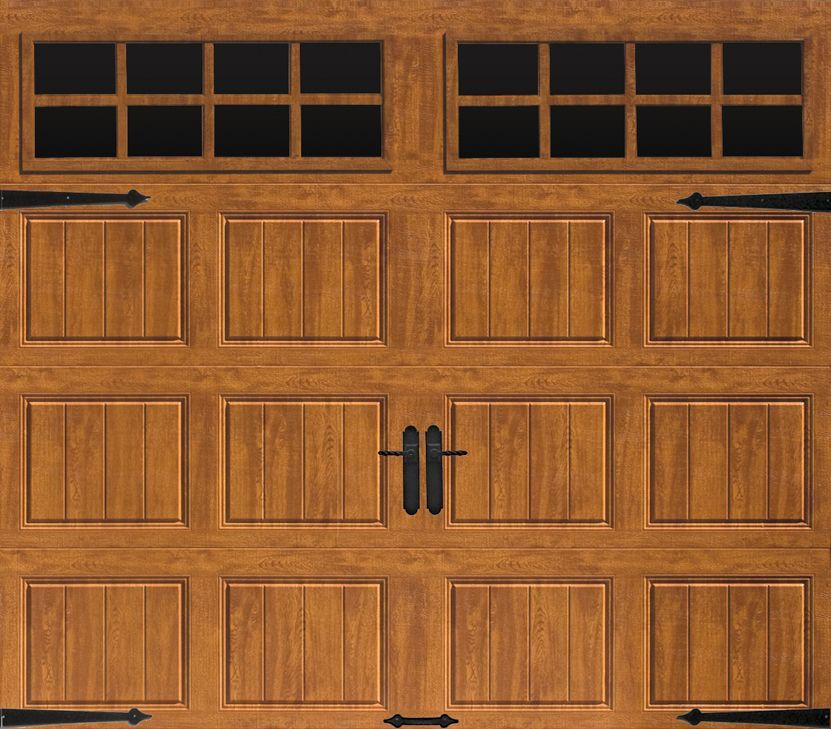 a wooden garage door with black handles and windows .