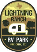 A logo for lightning ranch rv park in pipe creek texas
