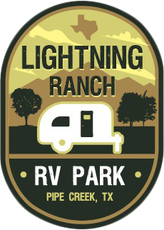 A logo for lightning ranch rv park in pipe creek texas