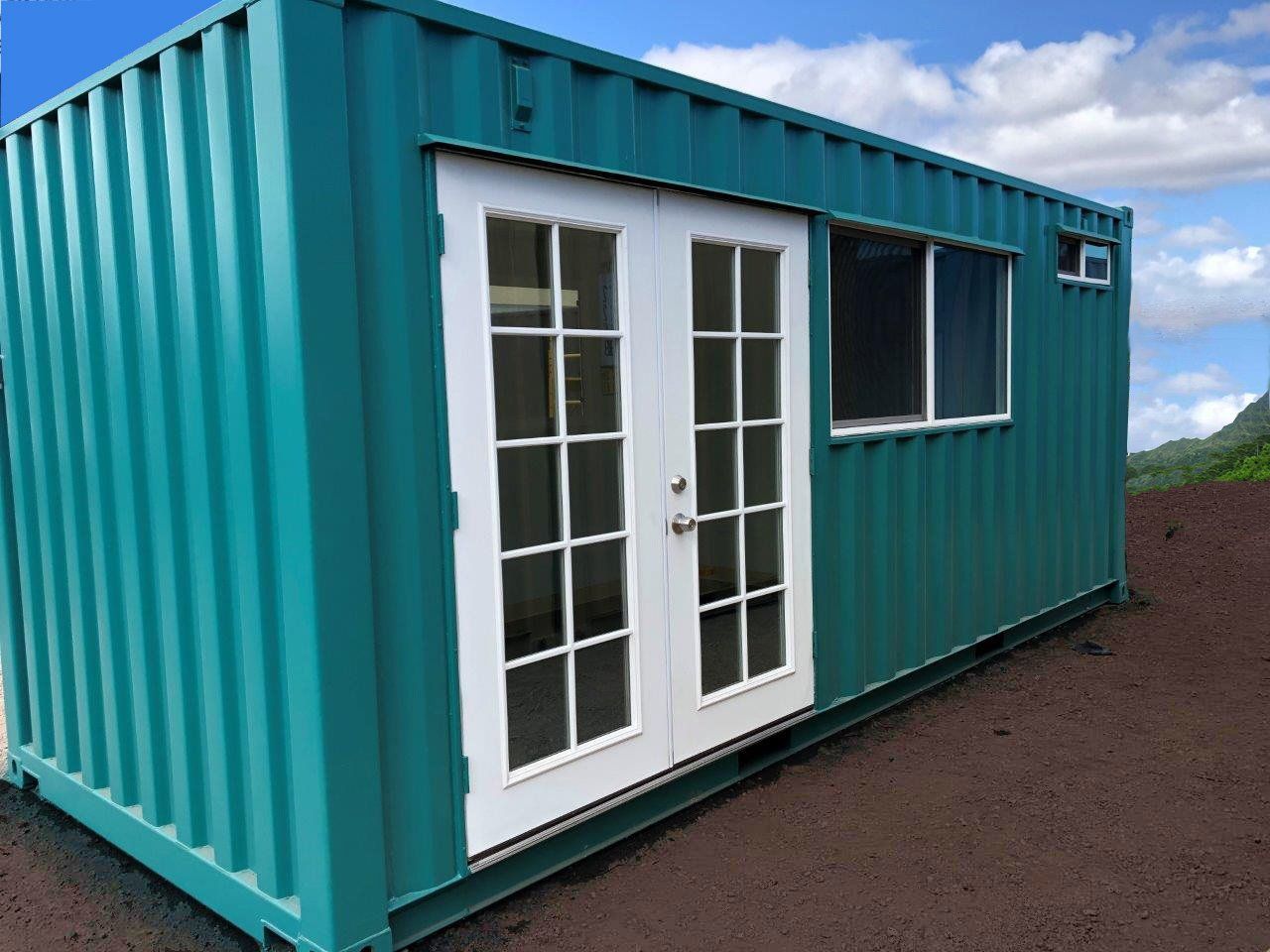 Outside of completed shipping container office showing specialized doors