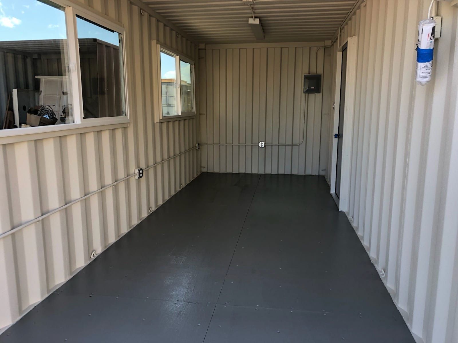 20' shipping container office interior, with finished floors and walls