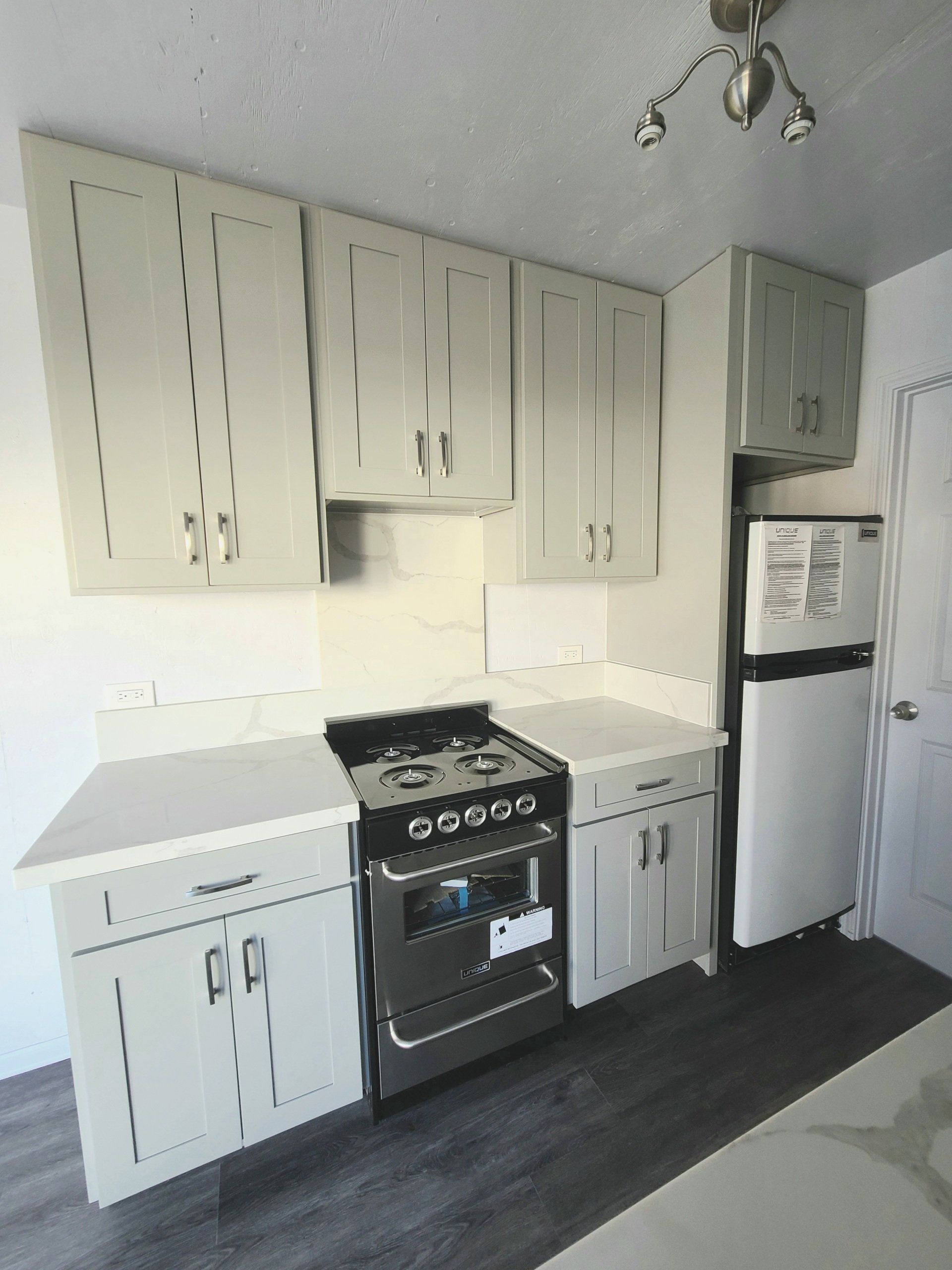 Custom Shipping Container Interior with kitchen, stove and refrigerator