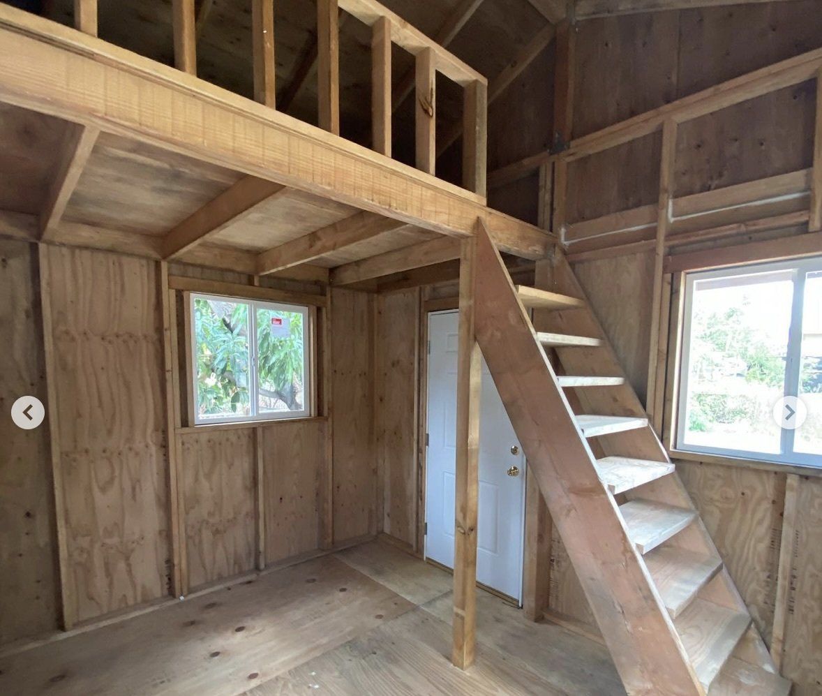 Studio shed with custom interior loft and stairs