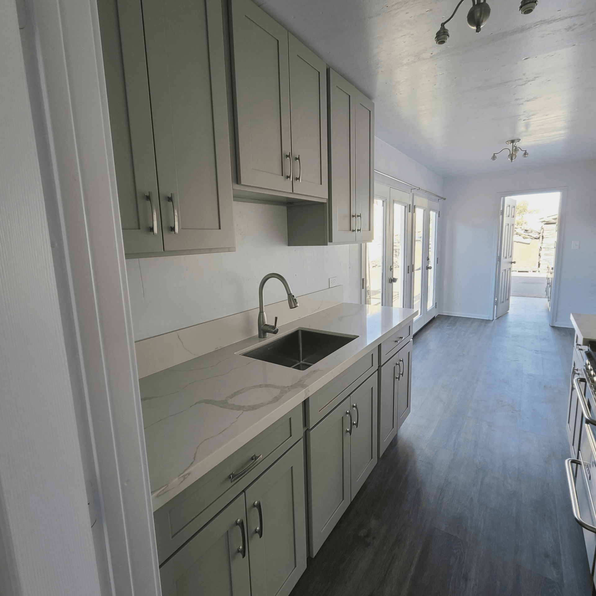 Custom Shipping Container Interior with kitchen cabinets and sink