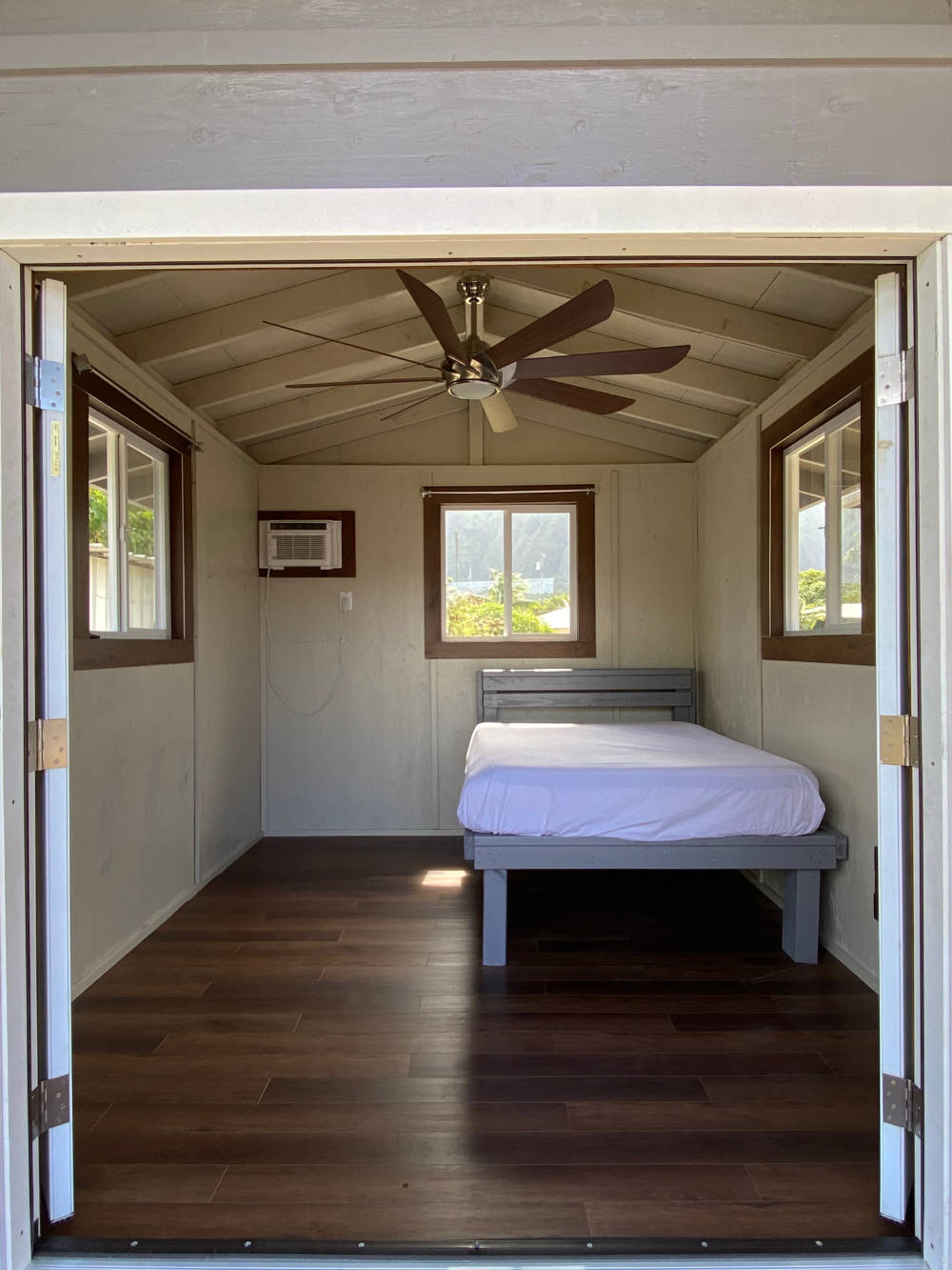 Studio shed with custom interior and roof with ceiling fan