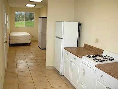 Custom Shipping Container Interior with kitchen and custom tile flooring